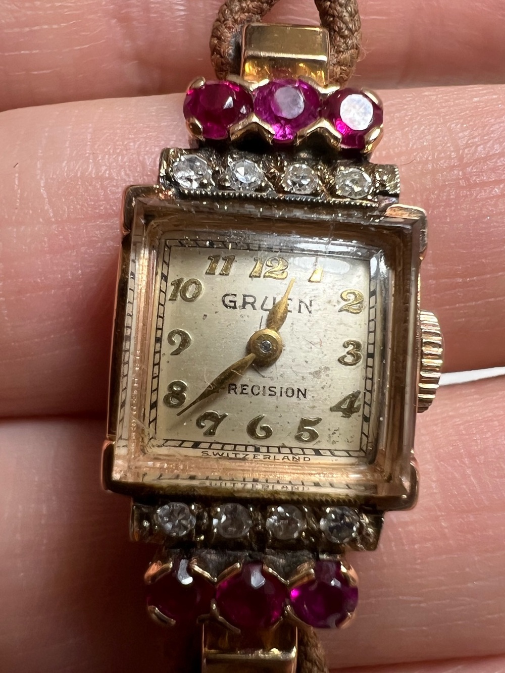 Gruen Precision wristwatch crafted in 14k rose gold with rubies and diamonds